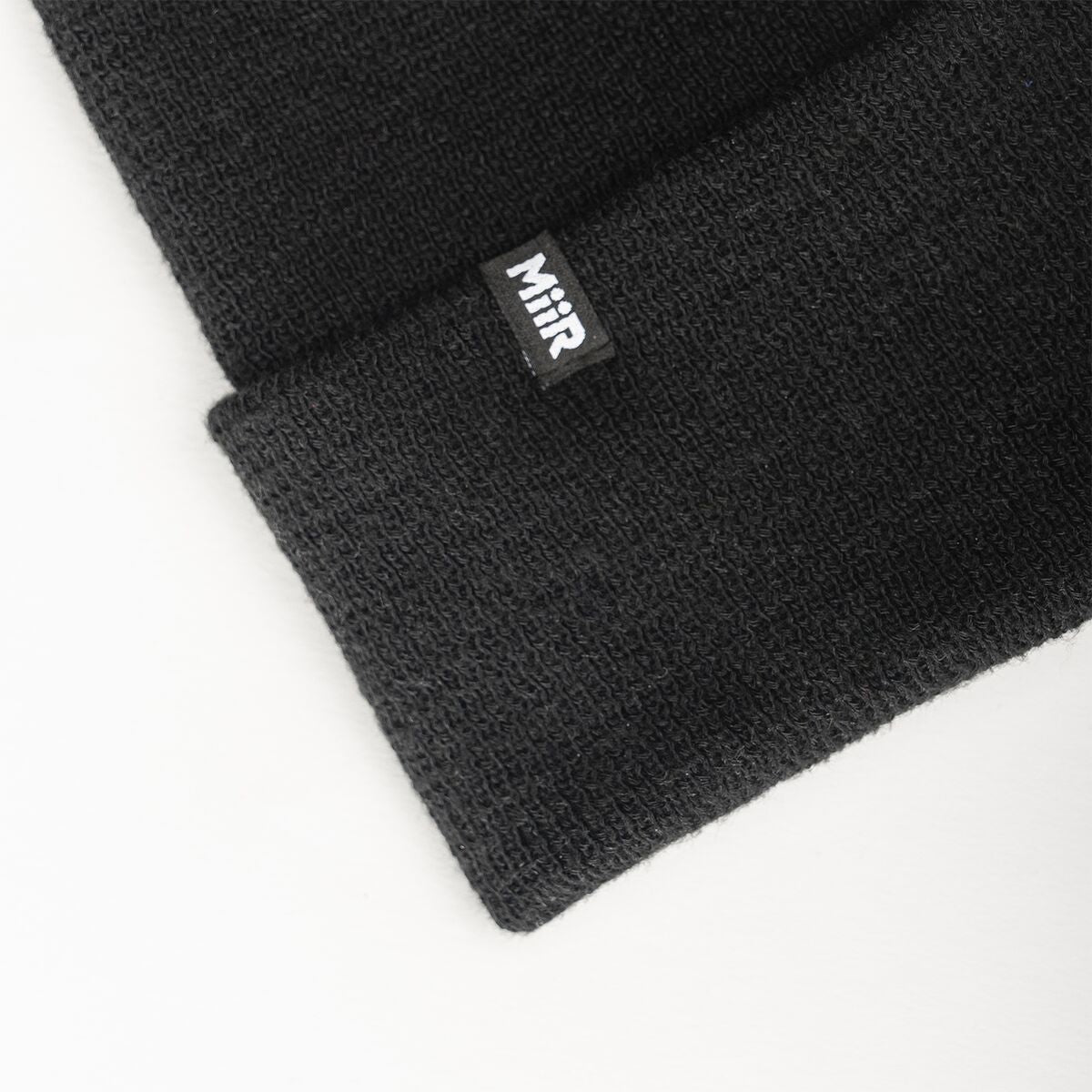 recycled-poly-fine-knit-beanie-q1 WebPDP-RecycledPolyFineKnitBeanie_Studio_TagDetail_Black__BNE005002OS.jpg